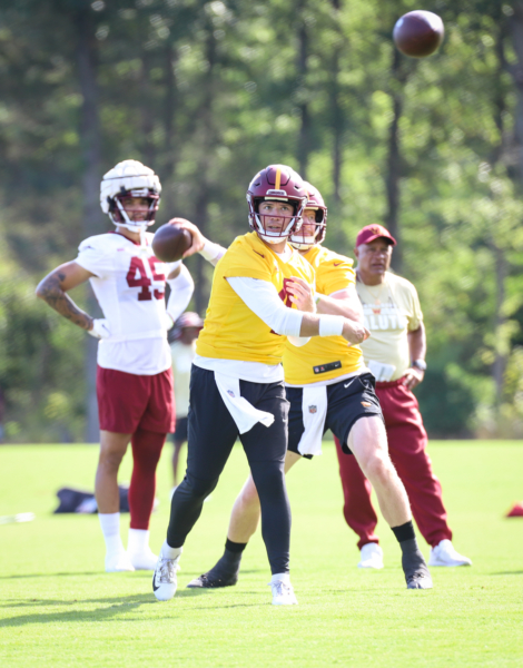 Washington Commanders Quarterback Taylor Heinicke (4) throwing t