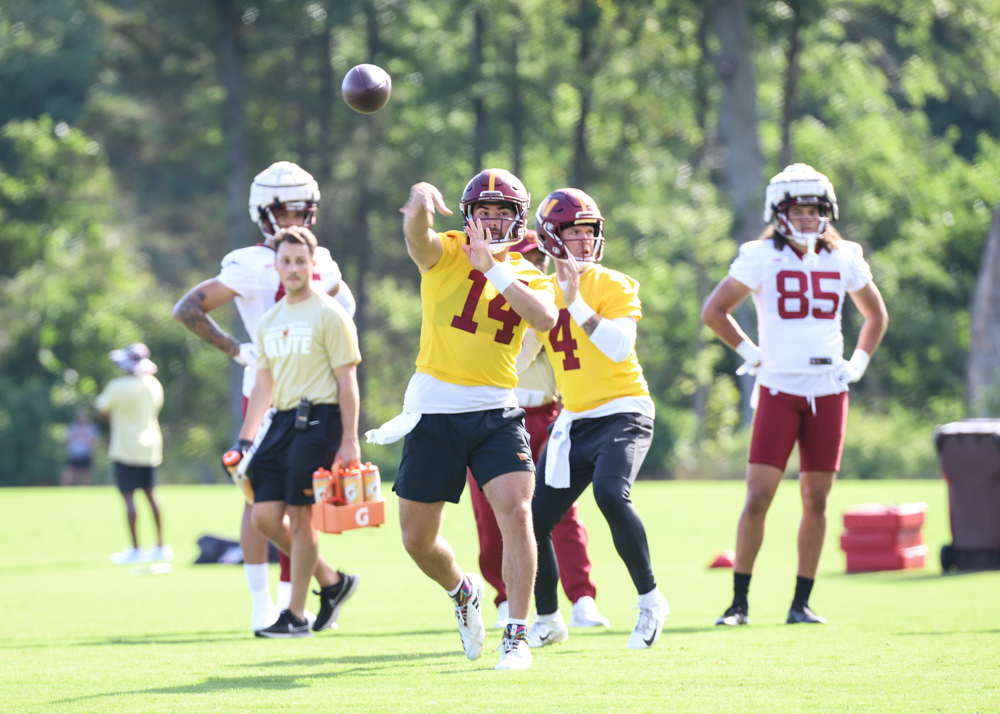 Washington Commanders Quarterback Sam Howell (14) makes a throw
