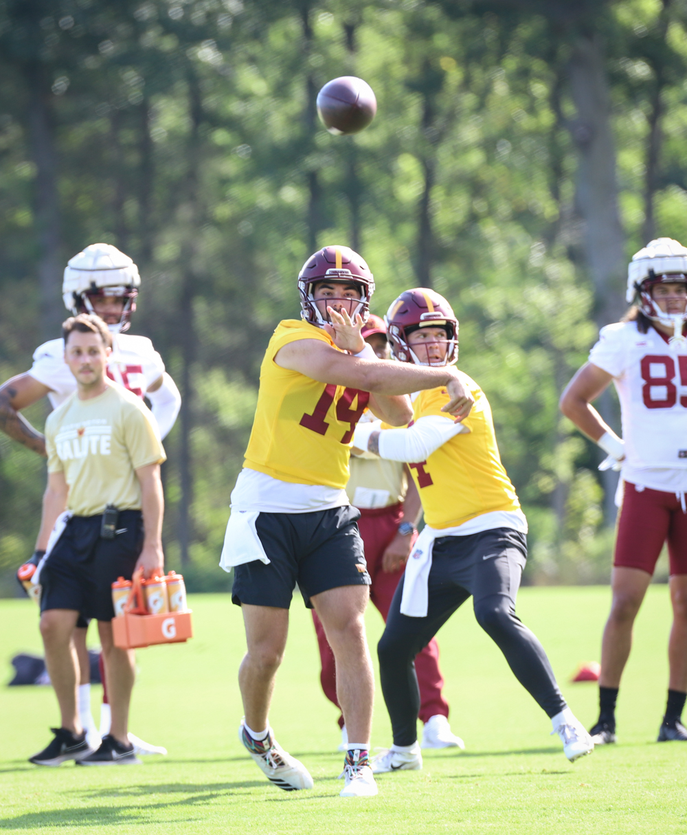 Washington Commanders Quarterback Sam Howell (14) makes a throw